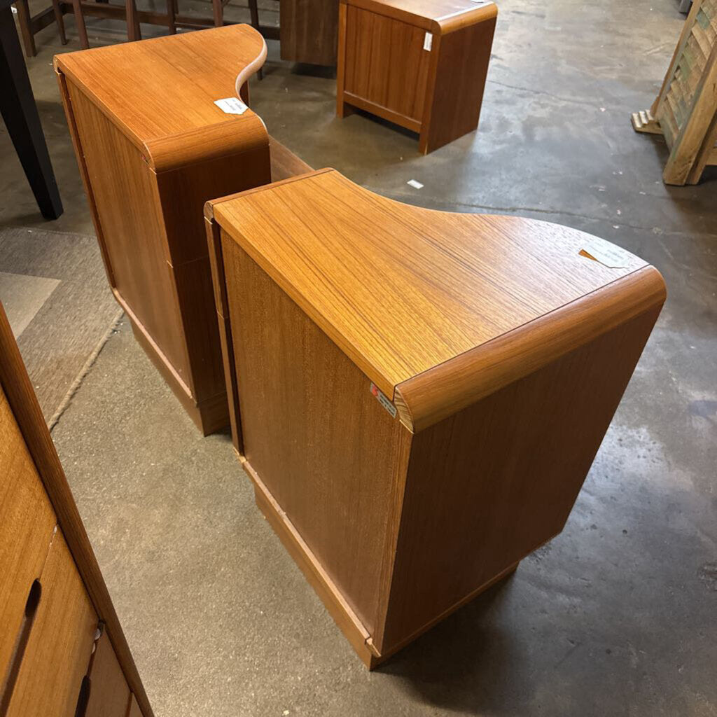 Wooden furniture pieces on a concrete floor