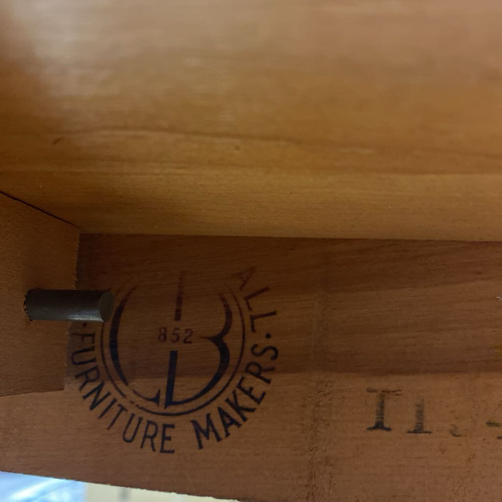 Wooden furniture with 'B&L Furniture Makers' logo engraved on it
