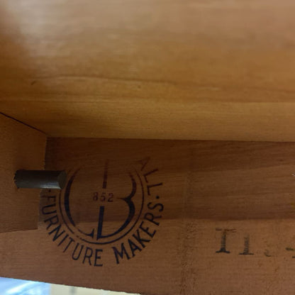 Wooden furniture with 'B&L Furniture Makers' logo engraved on it