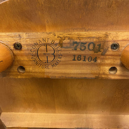 Wooden product with 'Baconant Ball & Furniture Makers' branding and numbers.