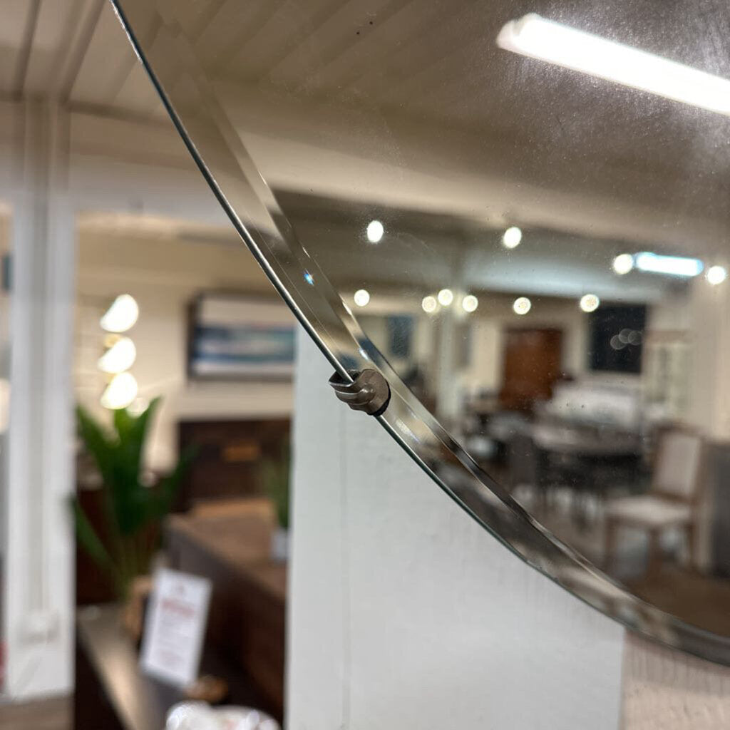 Glass partition with metal handle in an office setting