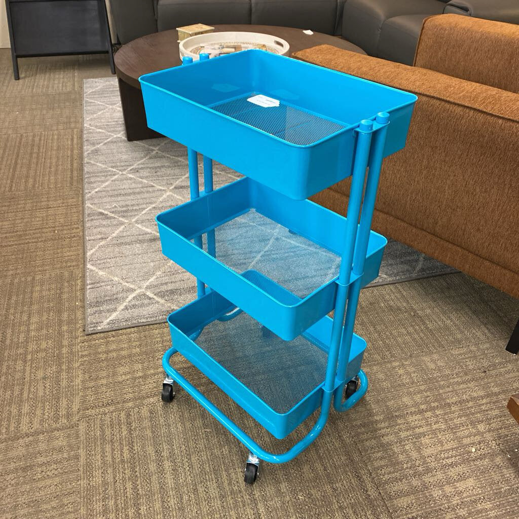 Blue three-tier rolling cart in a living room setting