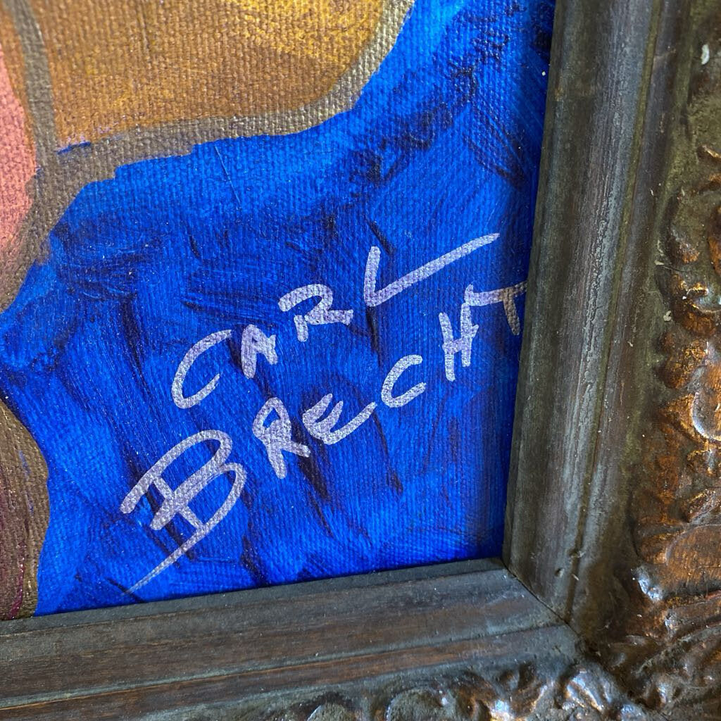 Signature on a piece of art with a decorative frame