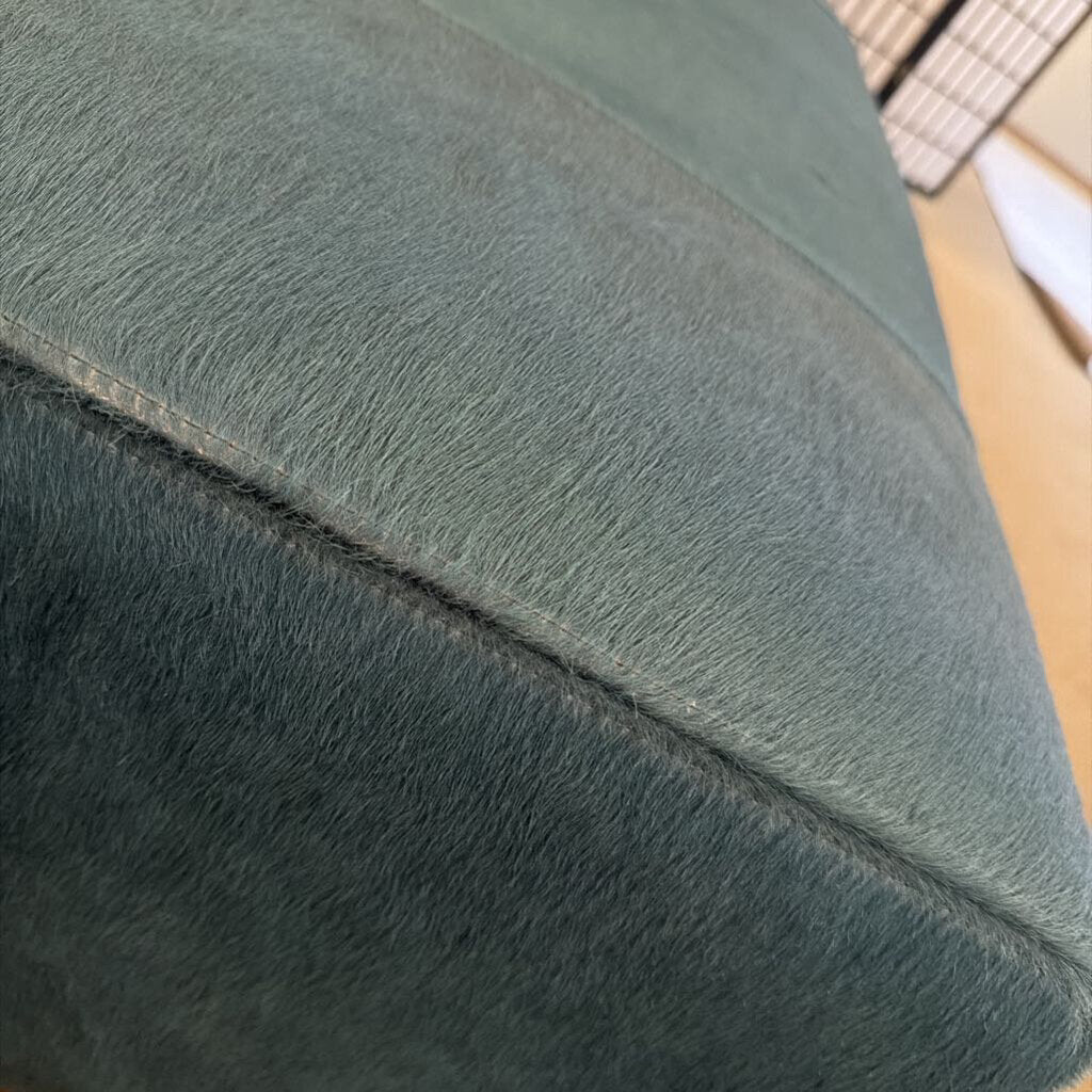 Close-up of a textured green fabric surface