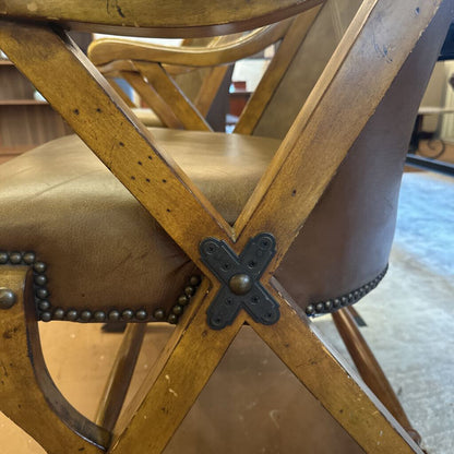 Close-up of a wooden chair with metal accents in an indoor setting