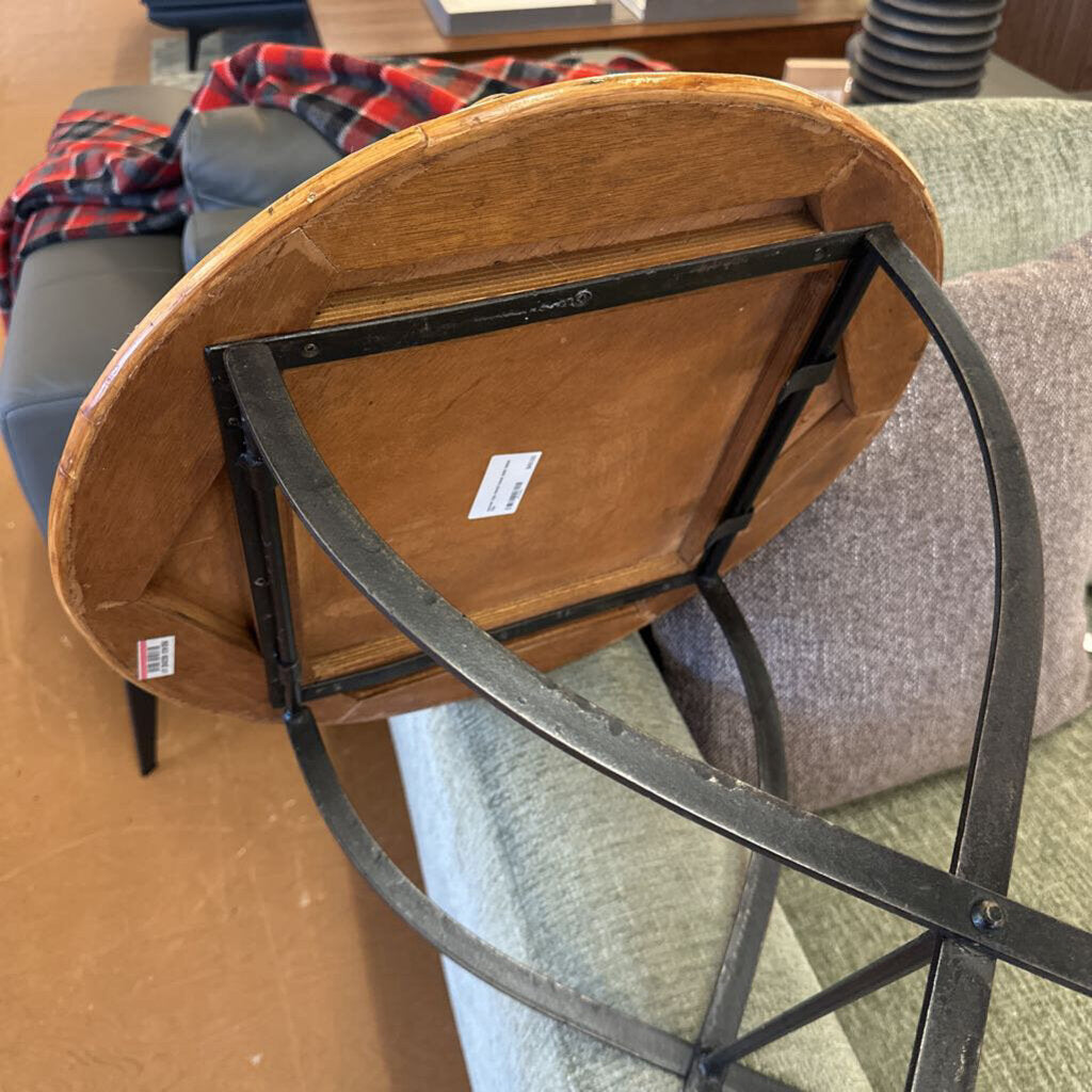 Wooden chair with metal frame on a carpeted floor