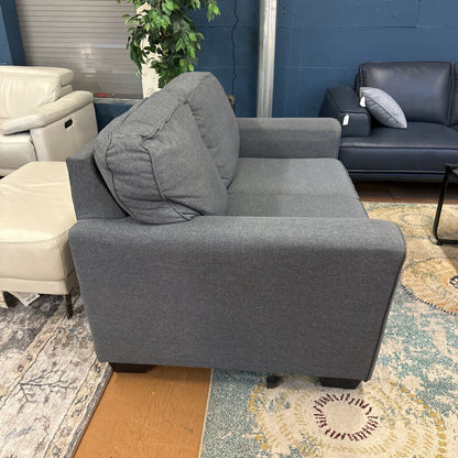 Gray sofa in a room with other furniture and decor