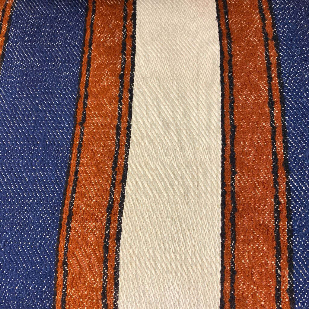 Close-up of fabric with blue, beige, and brown stripes.
