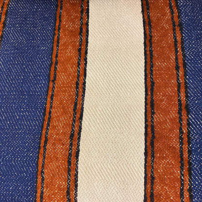 Close-up of fabric with blue, beige, and brown stripes.