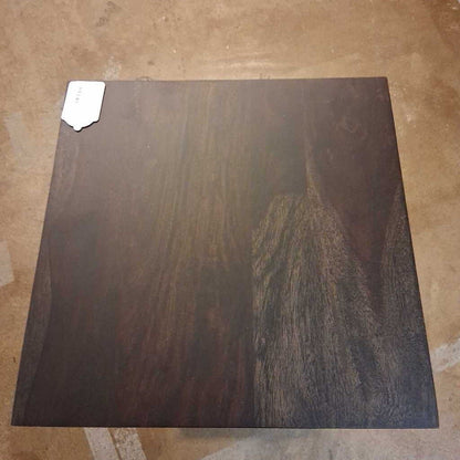 Dark wooden panel on a beige tiled floor