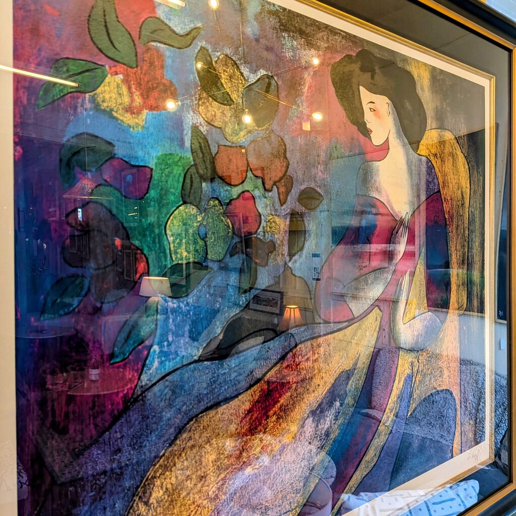 Colorful abstract artwork with a woman and floral elements