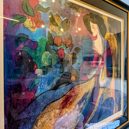 Colorful abstract artwork with a woman and floral elements