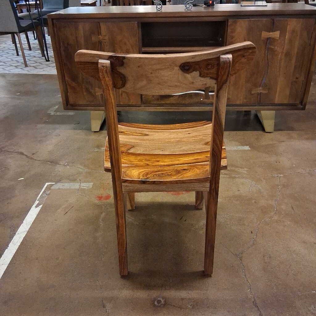 Wooden chair with a wooden desk in the background