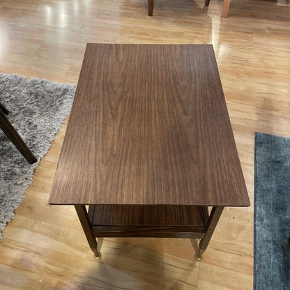 Wooden table on a wooden floor with rugs