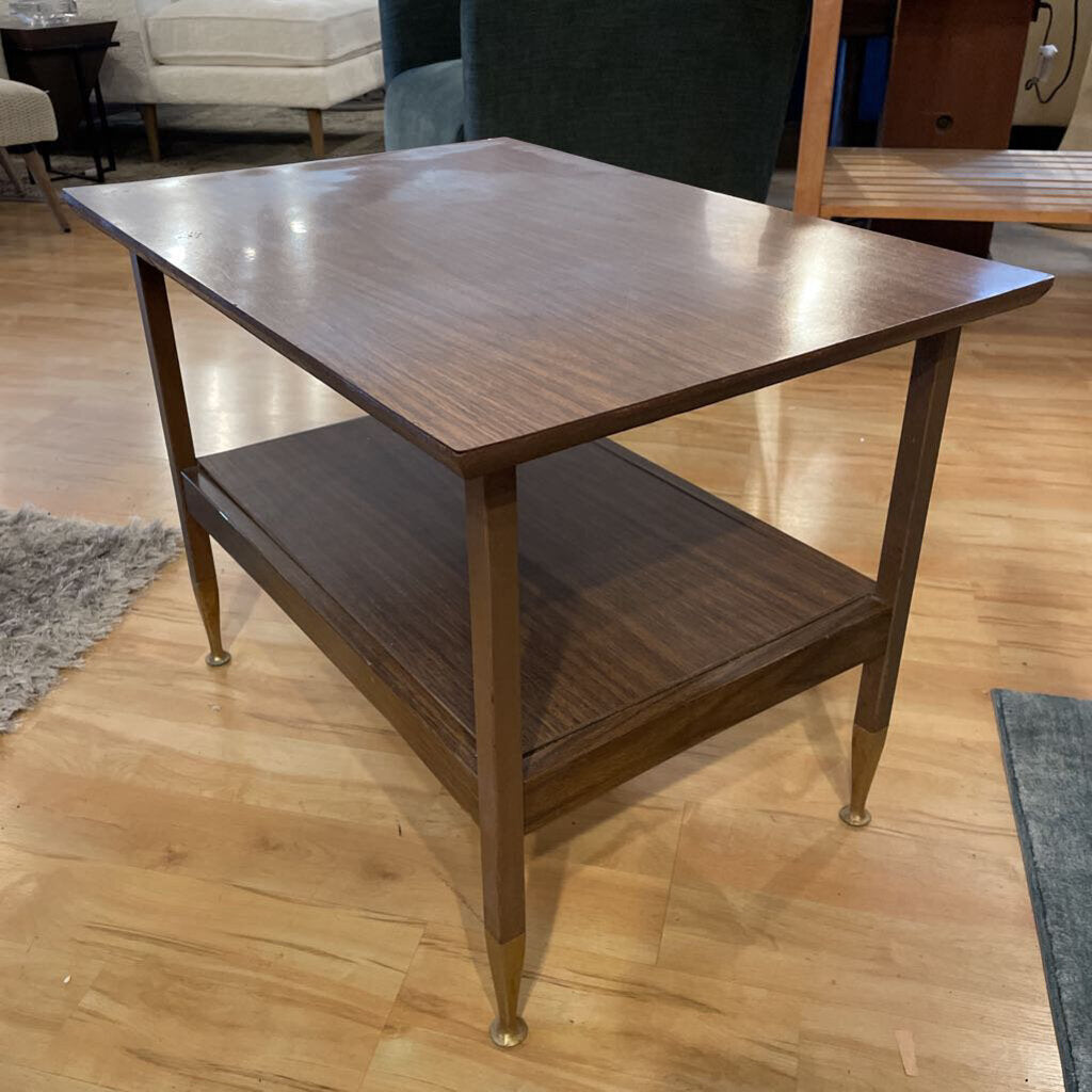Wooden side table with a shelf on a wooden floor
