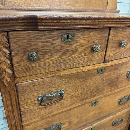Wooden dresser with metal handles on a white background