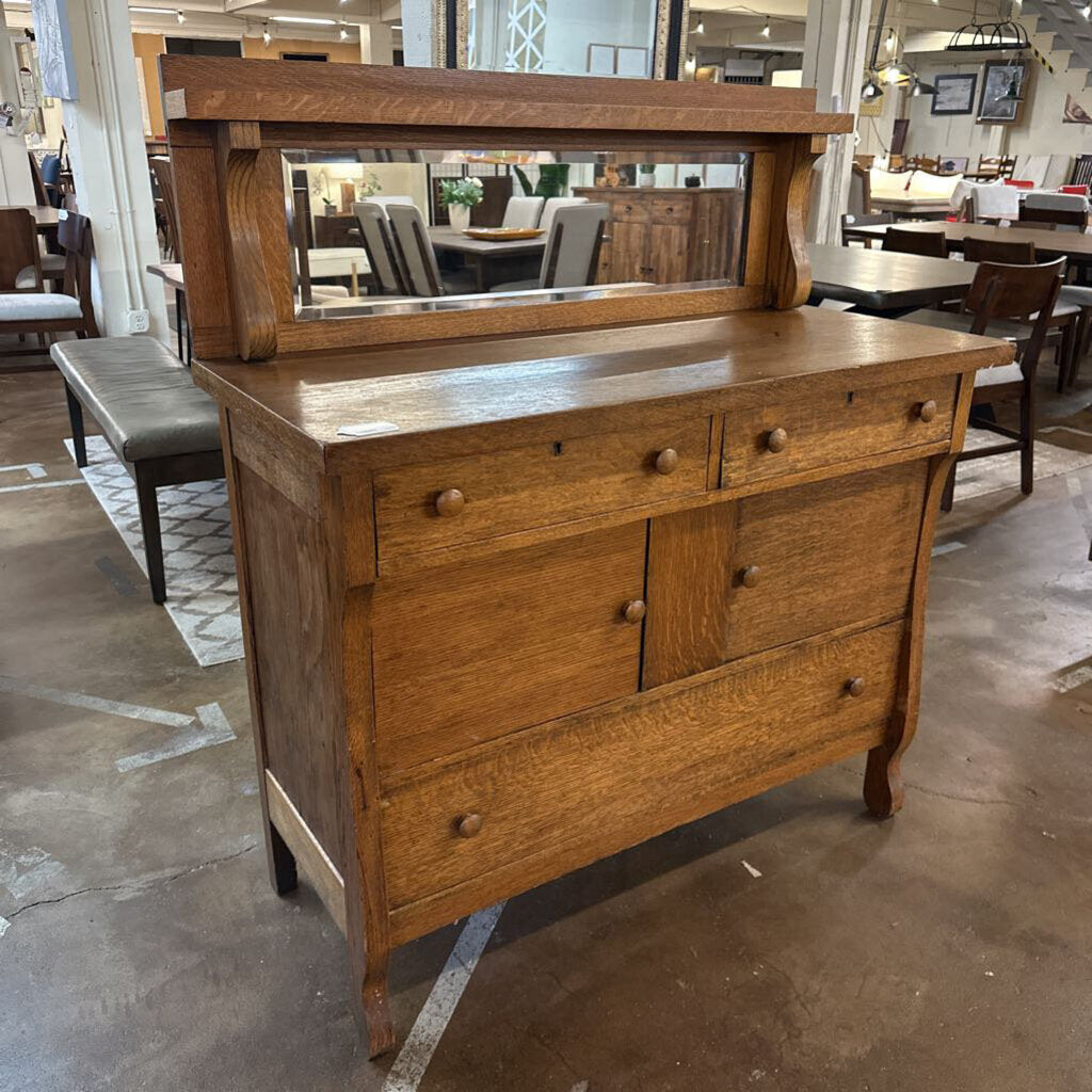 Wooden dresser with mirror in a furniture store