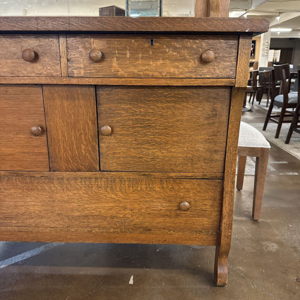 Wooden dresser with multiple drawers in a room setting