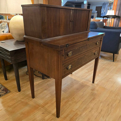 Wooden sideboard with two drawers and a cabinet in a living room setting