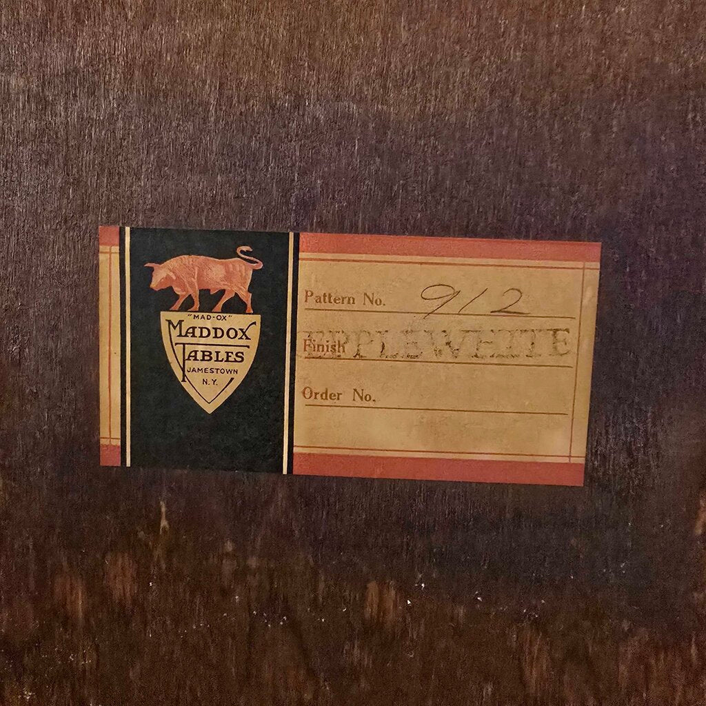 Vintage label with Madex Ables logo on a wooden surface