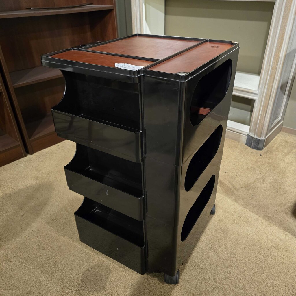 Black and brown storage unit on a carpeted floor