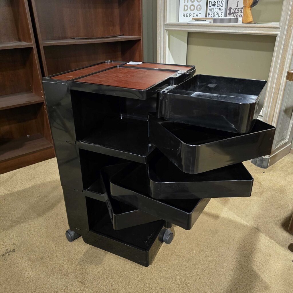 Black rolling cart with multiple drawers in a room setting