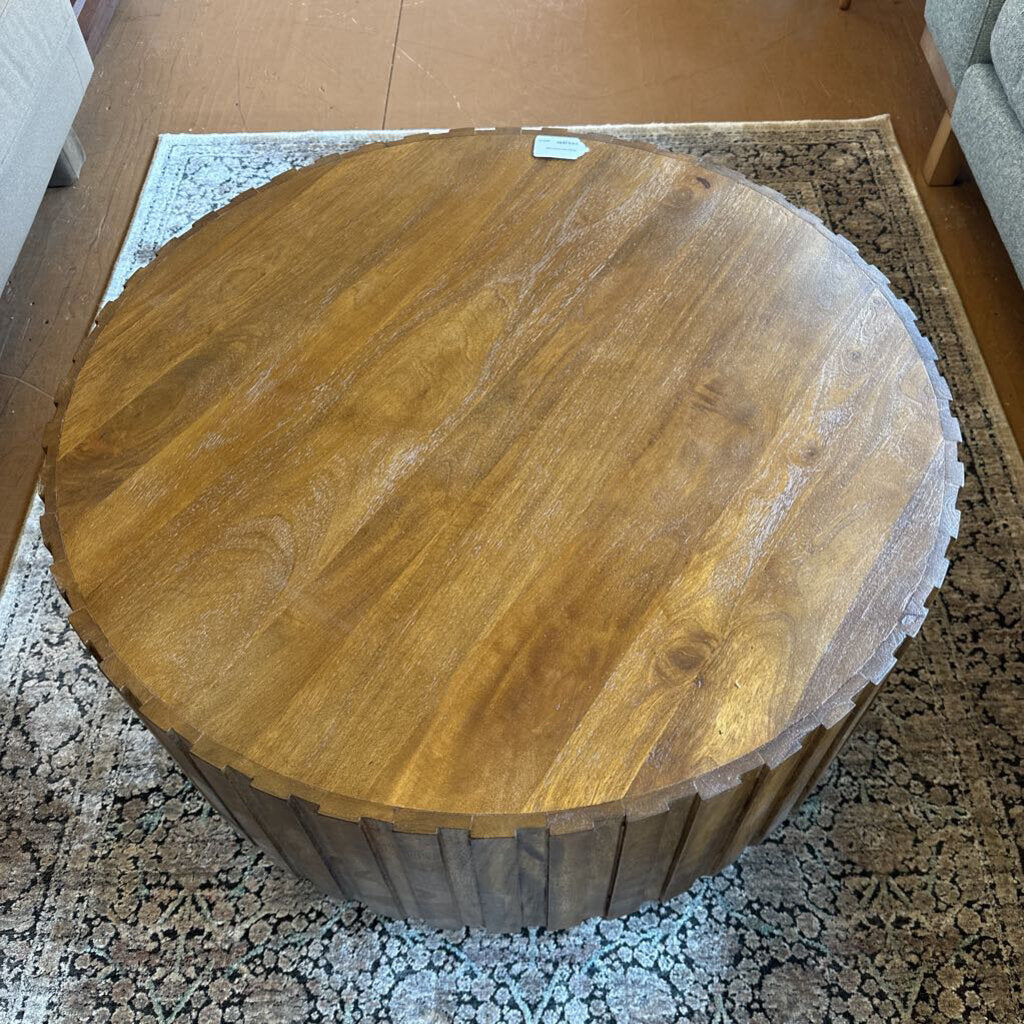 Round wooden table on a patterned rug