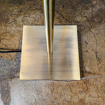 Gold metal sheet on a textured brown surface