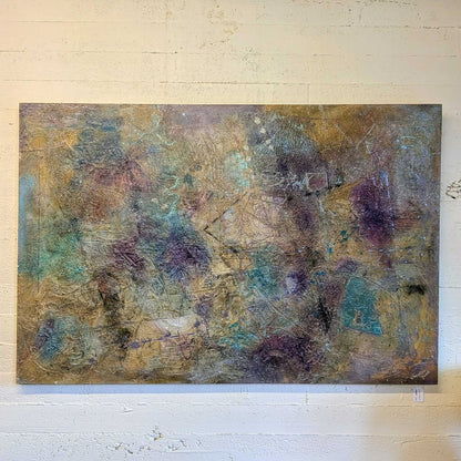 Abstract painting on a textured wall