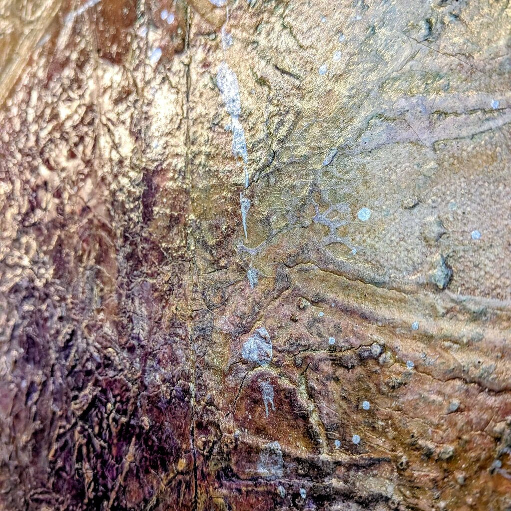 Close-up of textured stone surface with brown and beige tones