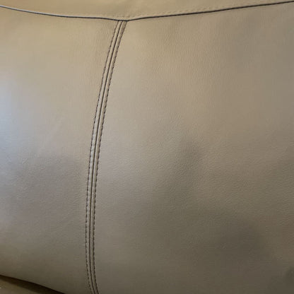 Close-up of beige leather with stitching detail