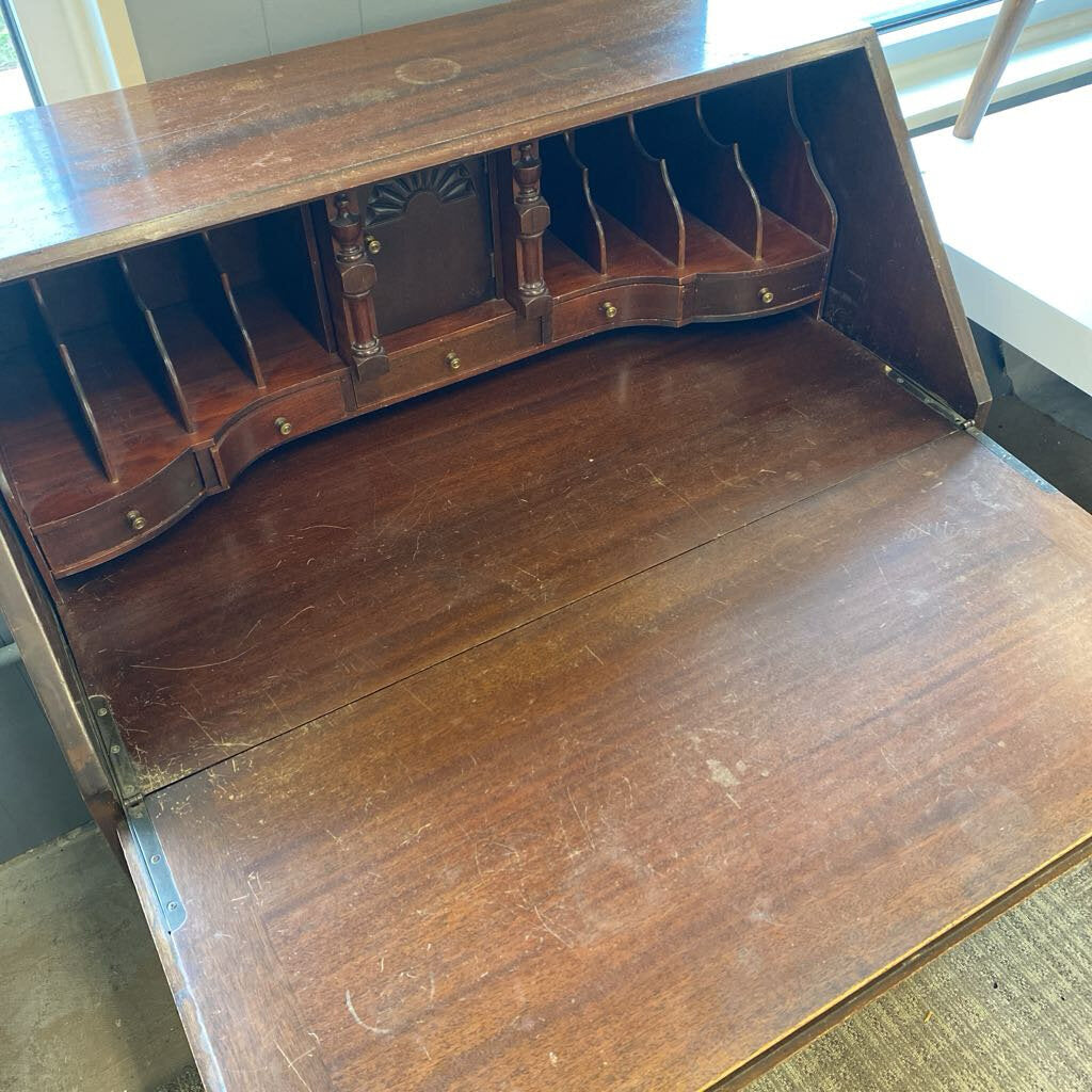 Wooden desk with open front panel showing shelves inside