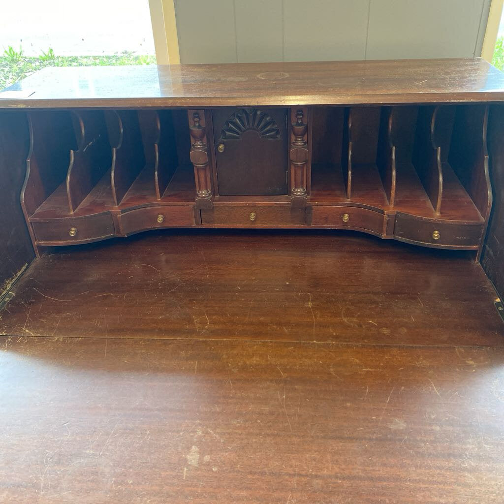 Wooden desk with open front panel showing shelves inside