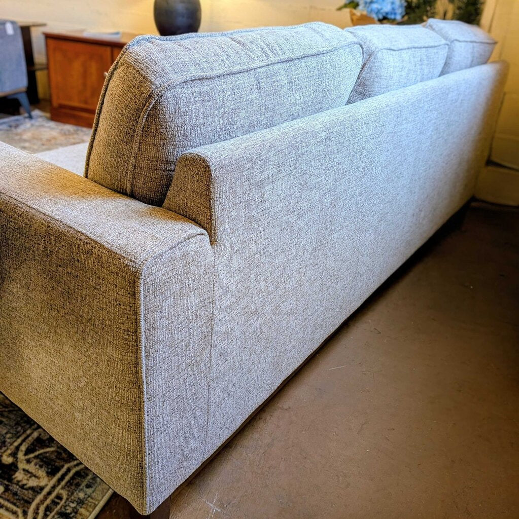 Gray and brown sofa in a living room setting