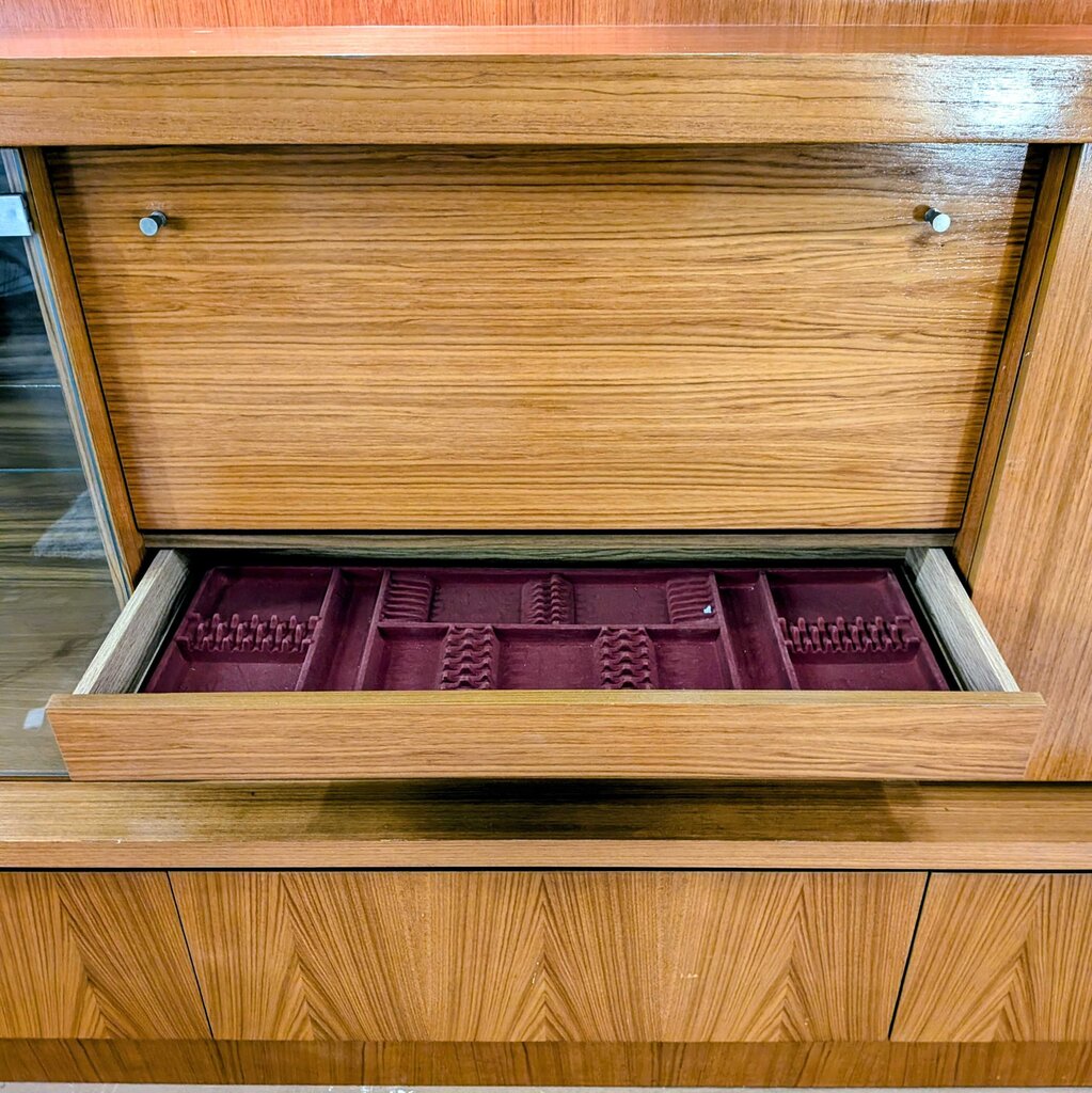 Wooden jewelry box with a purple interior tray