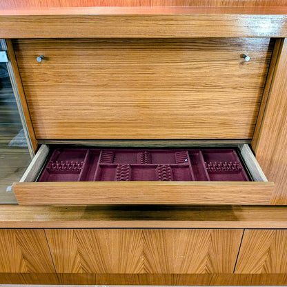 Wooden jewelry box with a purple interior tray