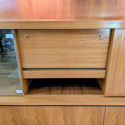 Wooden cabinet with a drawer and glass panel