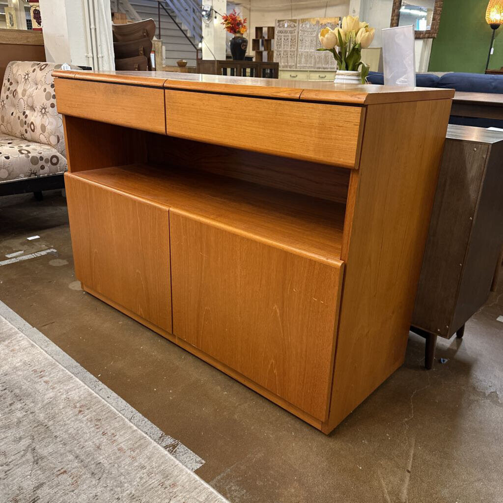 Wooden sideboard in a room with furniture and decor