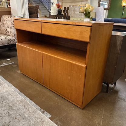 Wooden sideboard in a room with furniture and decor