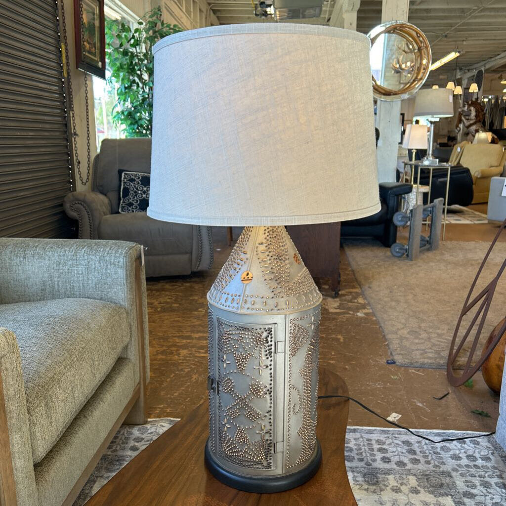 Decorative lamp with a textured base in a furniture store setting