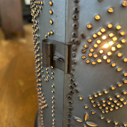 Decorative metal box with rivets and a latch on a blurred background
