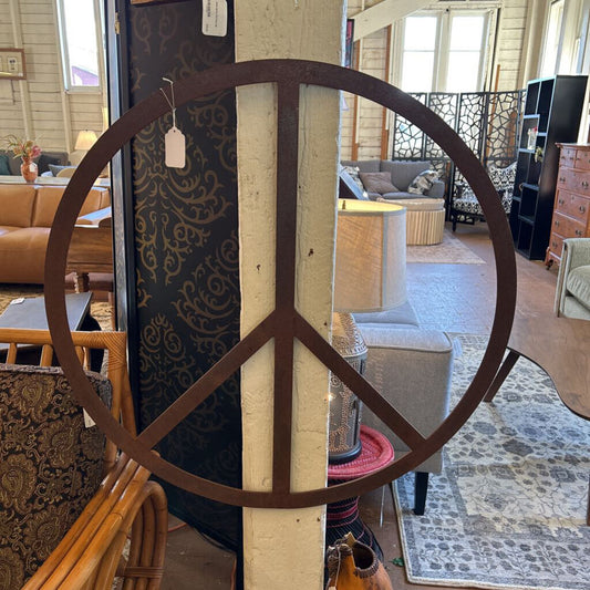 Peace symbol decorative item in a furniture store setting