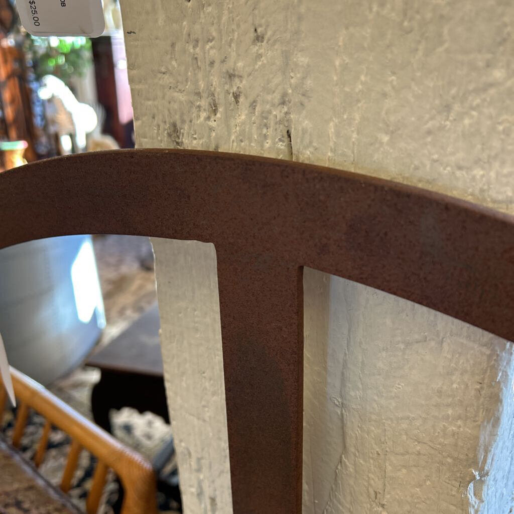 Close-up of a brown chair with a blurred background