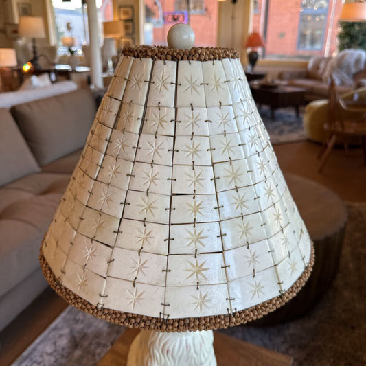 Decorative lampshade with star pattern in a living room setting