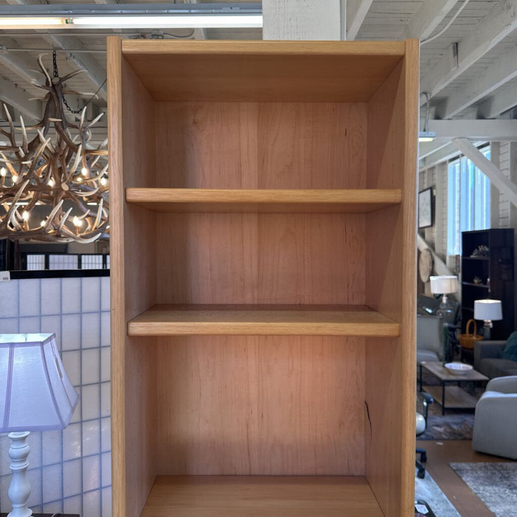 Wooden bookshelf in a room with decorative elements