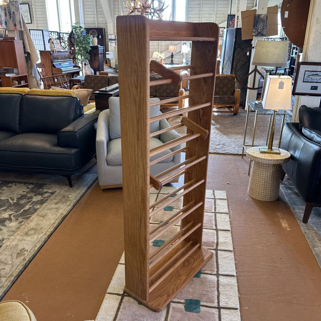 Wooden room divider in a furniture store with various items in the background