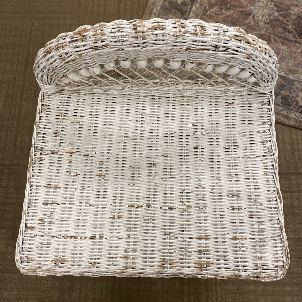 White wicker basket on a brown surface