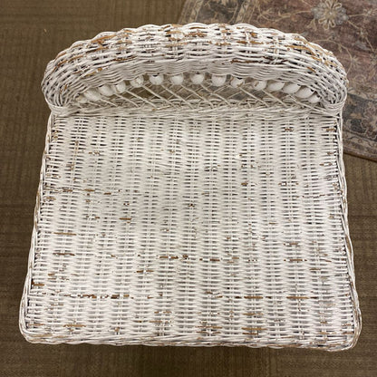 White wicker basket on a brown surface