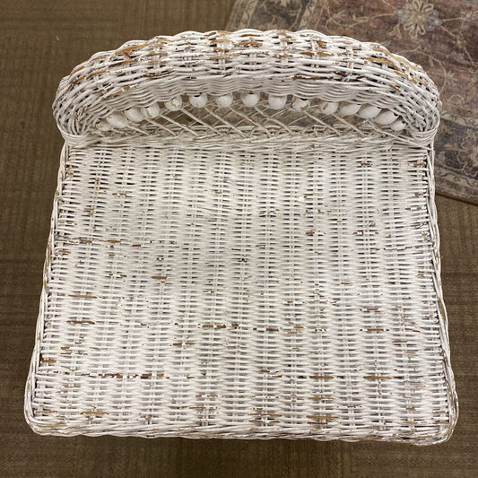 White wicker basket on a brown surface