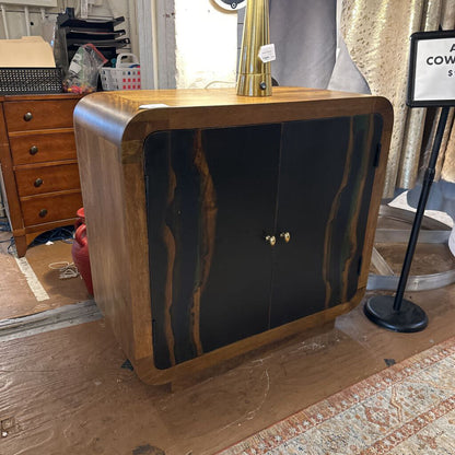 Wooden sideboard with black marble finish in a room setting